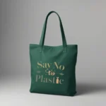 Durable eco-friendly bottle green canvas tote bag with a minimalist typographic design in earth tones. The text 'Say No to Plastic' is printed in olive green and soft orange, accented with small leaf and seedling illustrations.