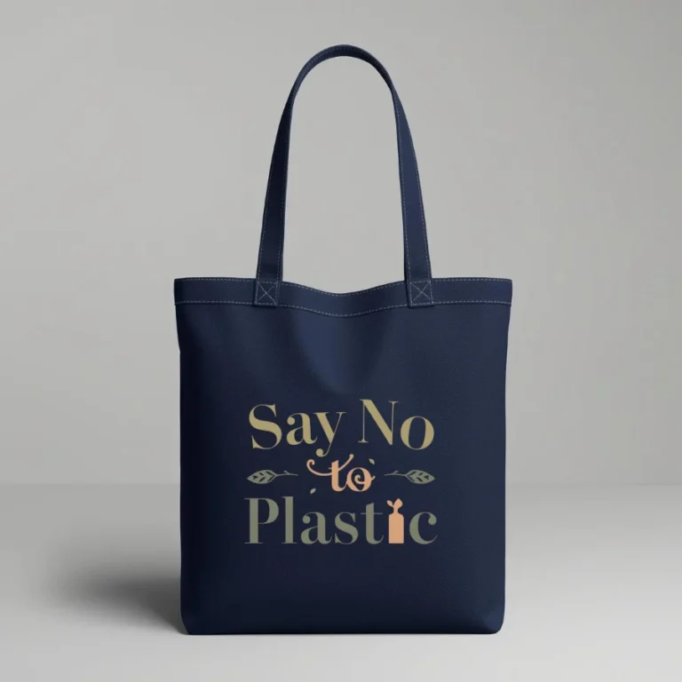 Durable, eco-friendly navy blue canvas tote bag with a minimalist typographic design in earth tones. The text 'Say No to Plastic' is printed in olive green and soft orange, accented with small leaf and seedling illustrations.