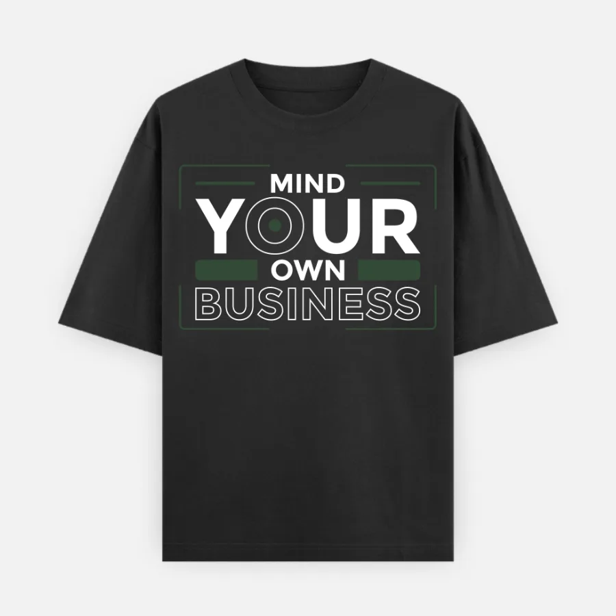 mind-your-own-business-oversized-black-tshirt 240 GSM Oversized graphic tee with 'Mind Your Own Business' typography, minimalist streetwear design.240 GSM Oversized black graphic tee with 'Mind Your Own Business' typography, minimalist streetwear design.